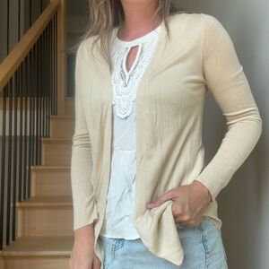Elegant Cream Cardigan Sweater with white blouse.